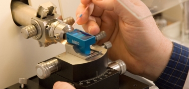 A hand using lab equipment