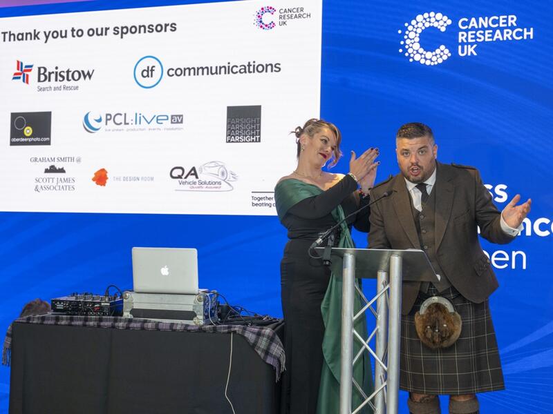 Presenters speaking at Business Beats Cancer Aberdeen event