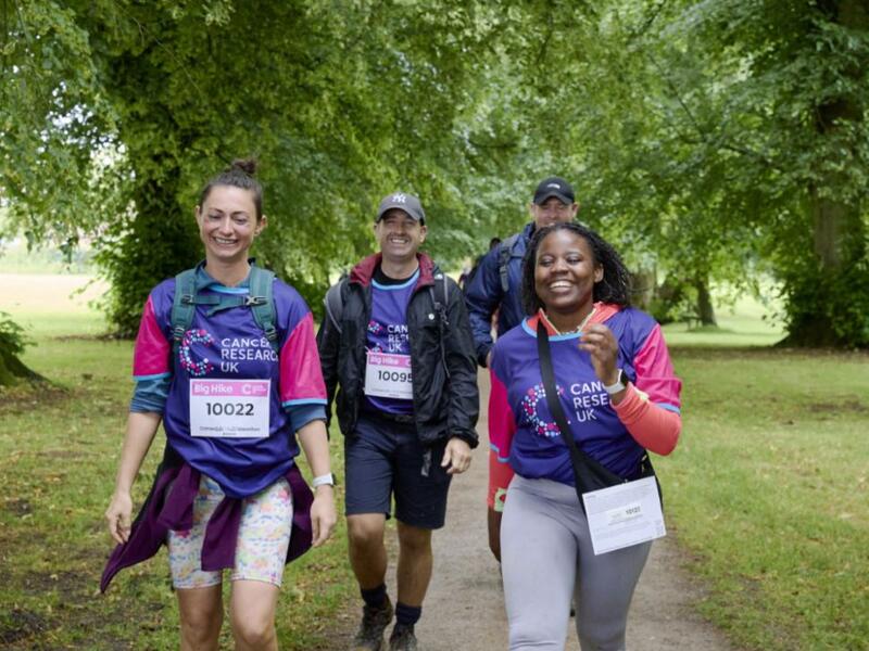 4 big hikers smiling 