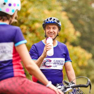 Cyclists drinking water