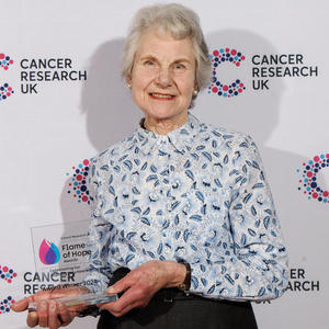 Diana holding her Flame of Hope trophy