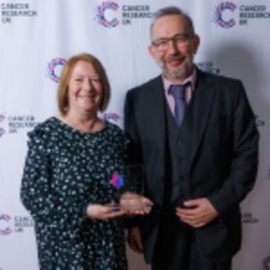 Ann and Gary holding their Flame of Hope award