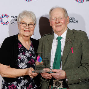 John holding his Flame of Hope trophy