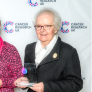 Josie holding her Flame of Hope trophy