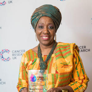 Mary holding her Flame of Hope trophy