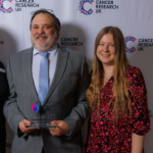 Richard holding his Flame of Hope award and guest