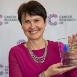 Wendy holding her Flame of Hope trophy