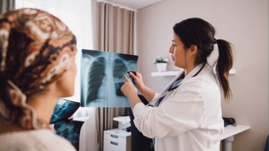 Dr showing patient a x-ray of lungs Dr showing patient a x-ray of lungs