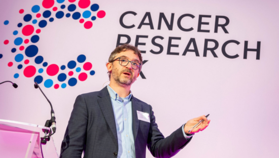 Researcher presenting at CRUK conference