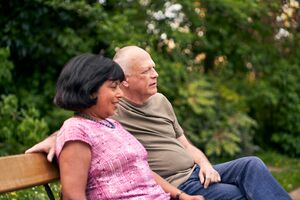 Image of a couple on a park bench