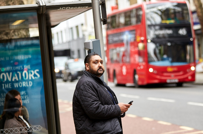 Man waiting at bus stop