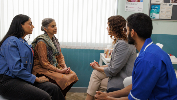 Doctors speaking to the patient and her carer.