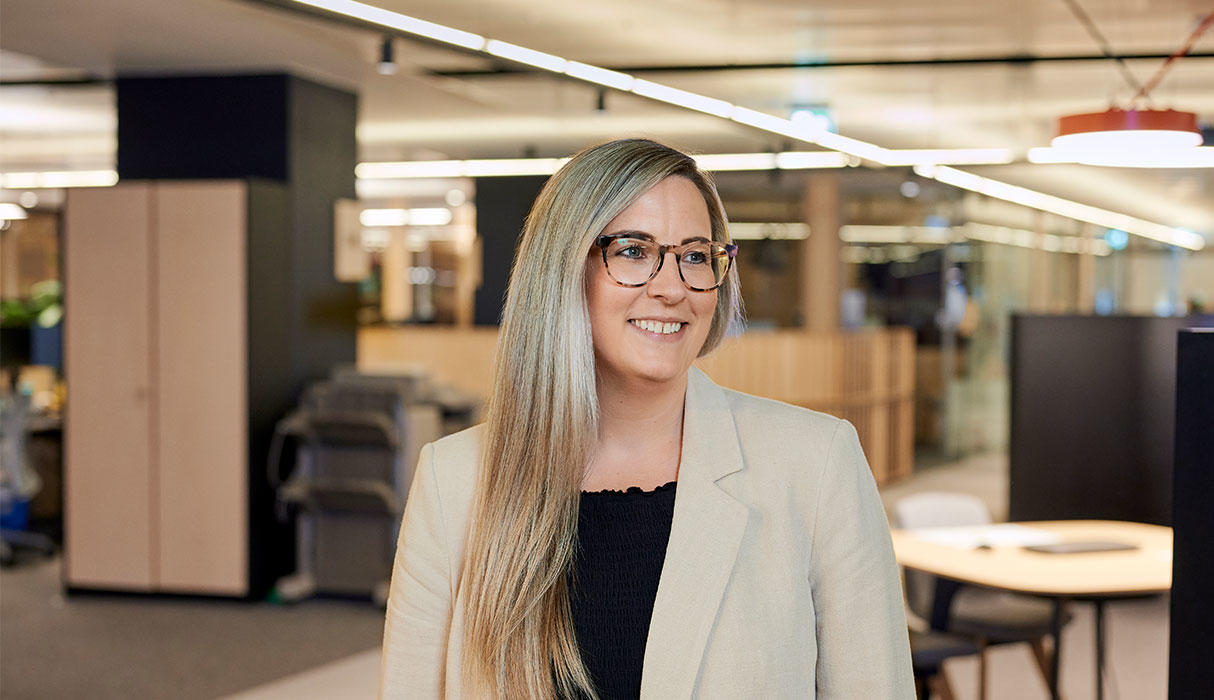 Photo of a person in the office smiling