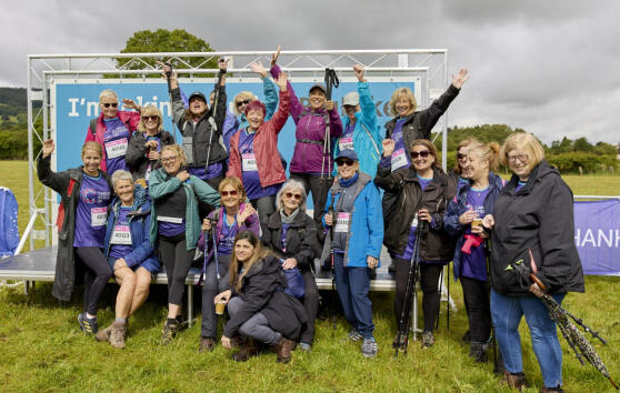 A crowd of Big Hike participants cheering at the camera 