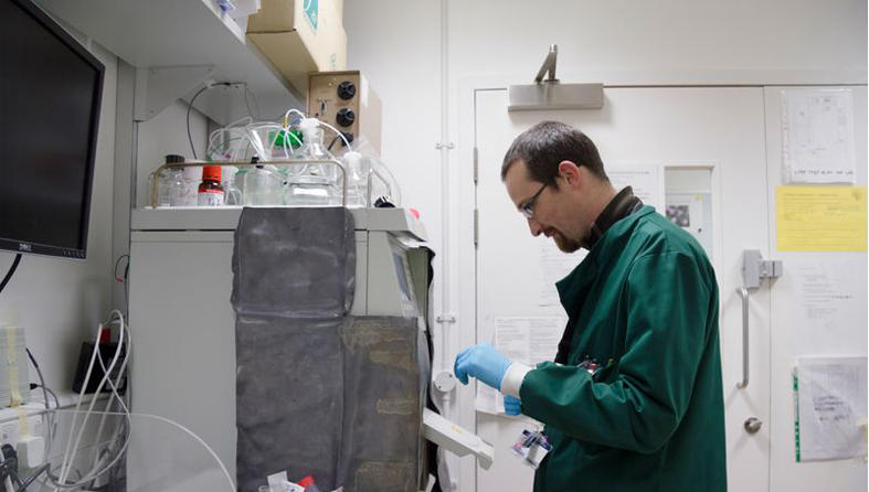 Researcher setting up machinery