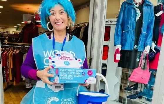 Woman wearing blue wig and tutu fundraising