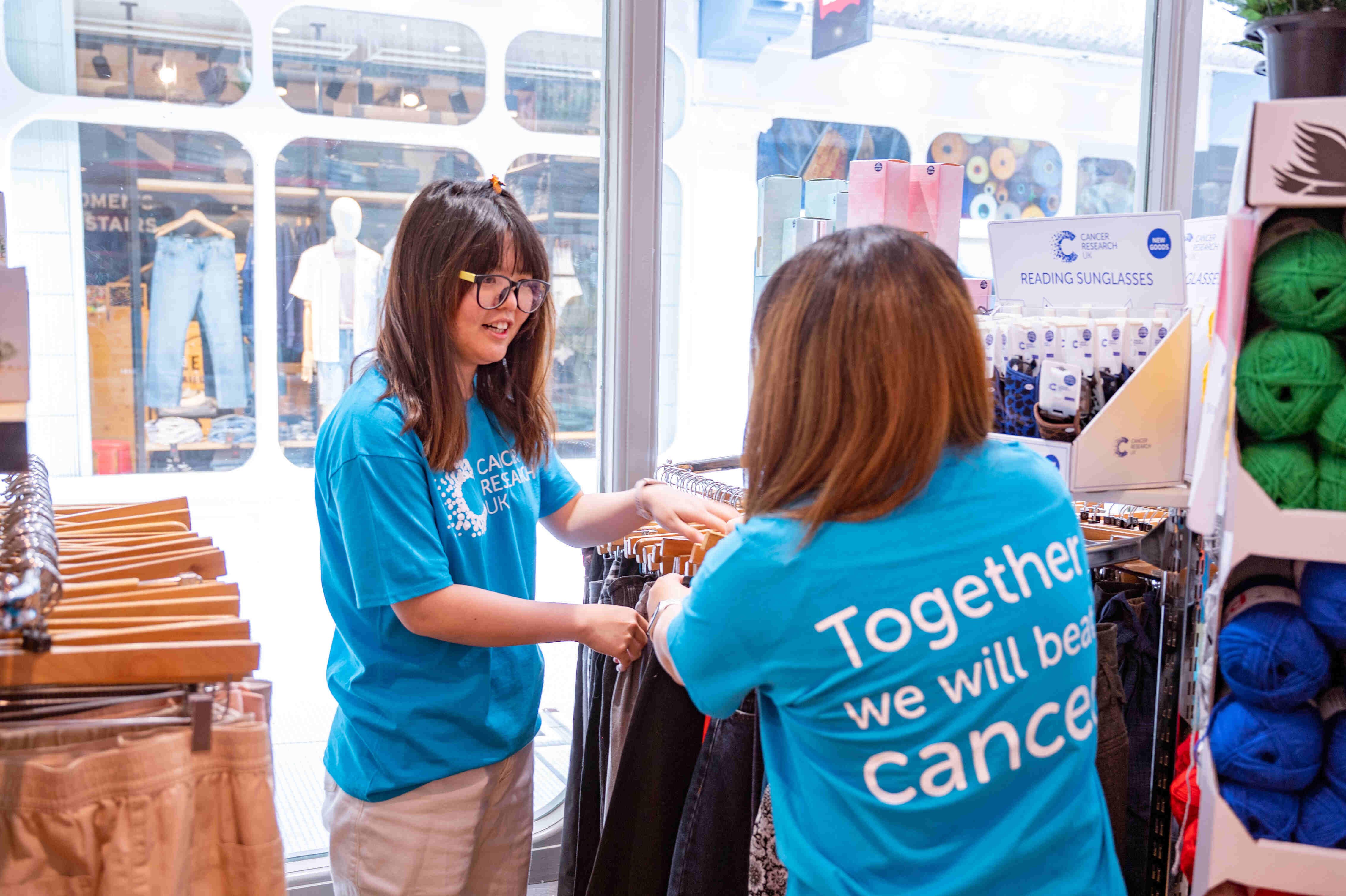 volunteers working at a cruk shop