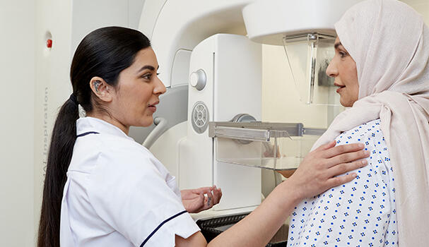 A mammographer with a patient