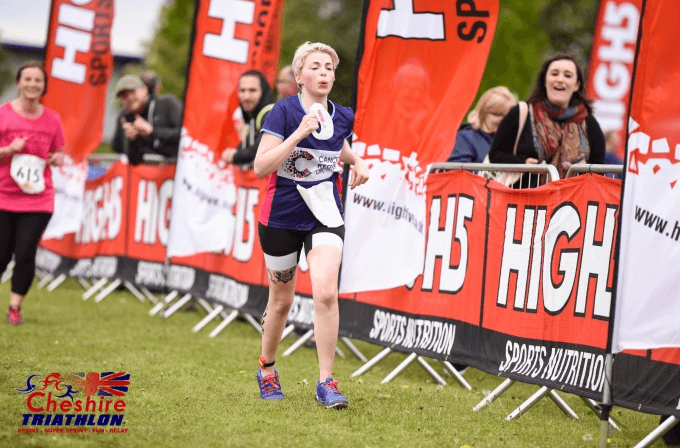 Woman running the Cheshire Triathlon for CRUK