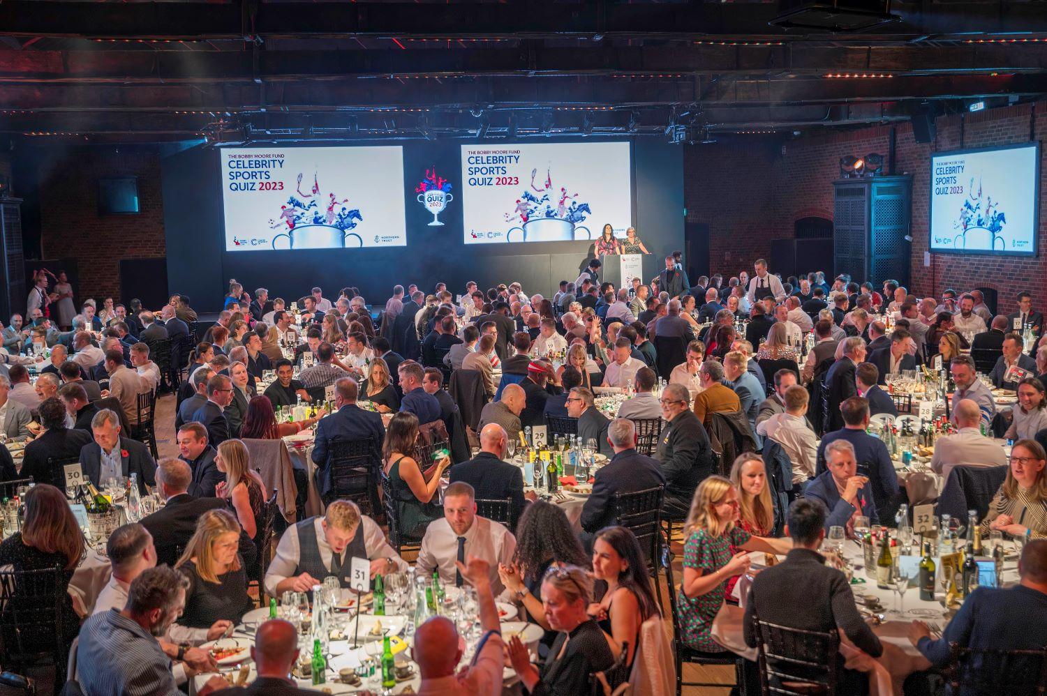 Image of guests sat at tables at Sports Quiz