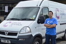 A driver with a Cancer Research UK van