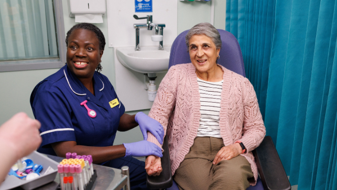 Nurse preparing to draw blood from a patient