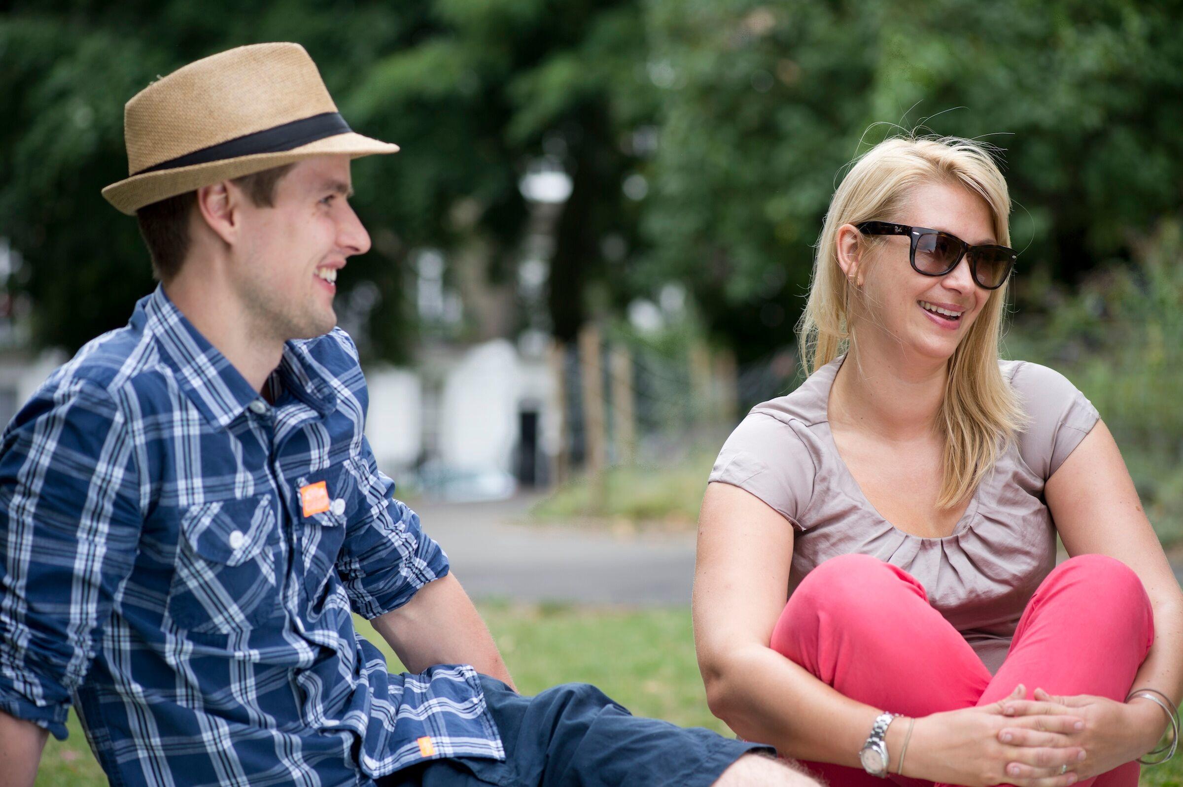 Two people being sun safe