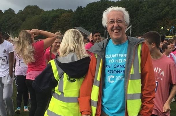 Event volunteers cheering on participants