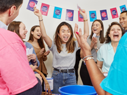 Men and women celebrating at a CRUK fundraising event