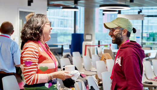 A photo of two Cancer Insights Panel member talking 