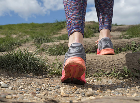 A photo of a person's shoes whilst walking