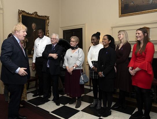 Volunteers talking with Boris Johnson