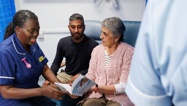 Patient undergoing Chemotherapy at the hospital talking to a health professional