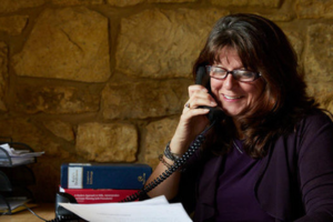 A solicitor on the phone to her client