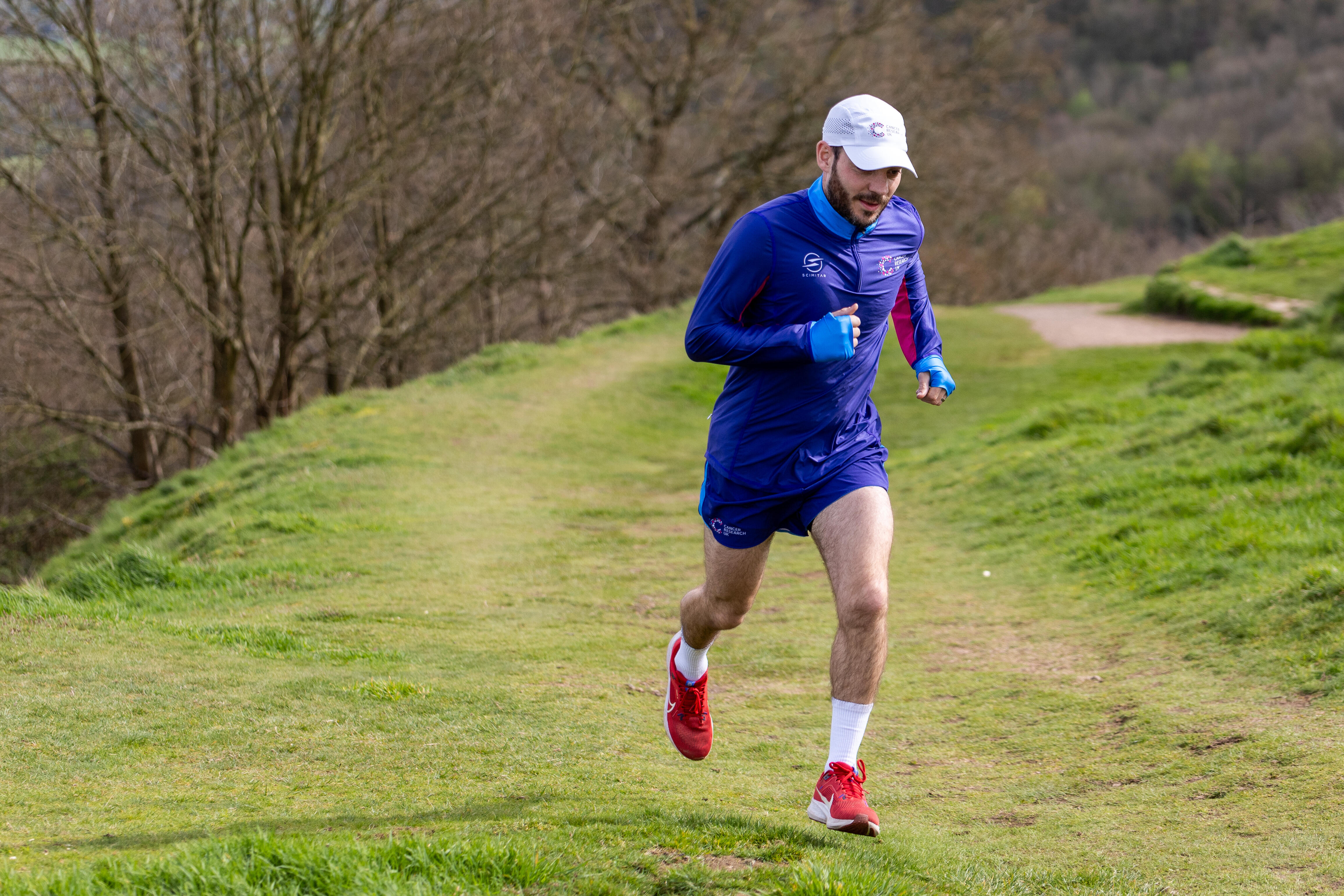 Man wearing CRUK branded gear