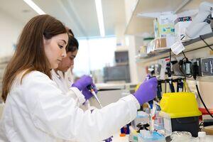 Women in a lab using equipment