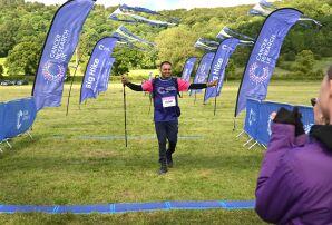 man celebrating at the finish line