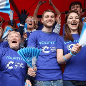 Cancer Research UK volunteers cheering 