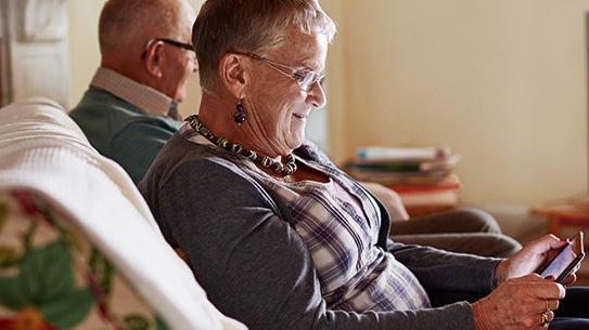 Woman using a tablet at home