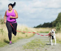 woman and dog running