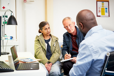 A couple talking to a doctor 