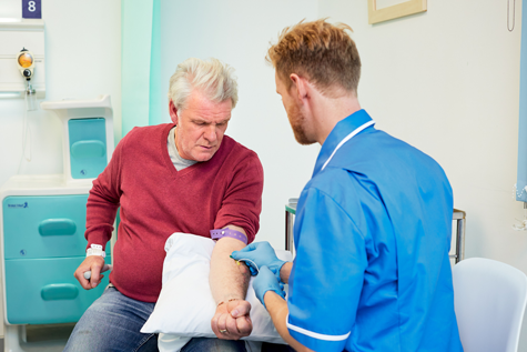 Photo of a man having a blood test